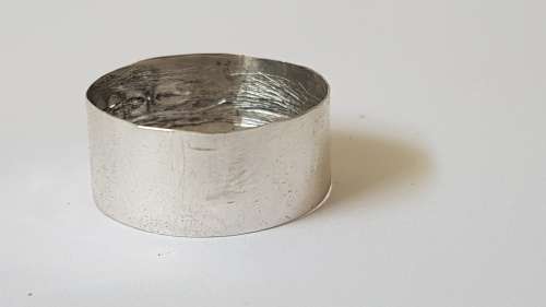 Solid sterling silver hallmarked ring.  Made from vintage bottle lid.