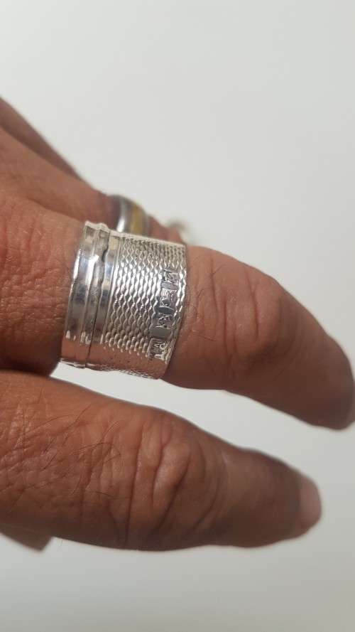 Hand made Sterling Silver ring. Engine turned pattern on the band. Hallmark on band as well.  4.1 g.