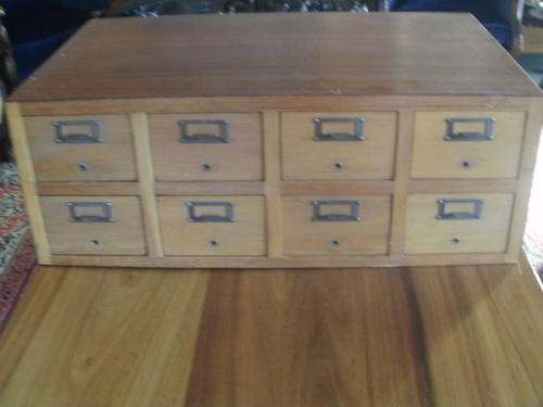 CUPBOARD WITH EIGHT DRAWERS.