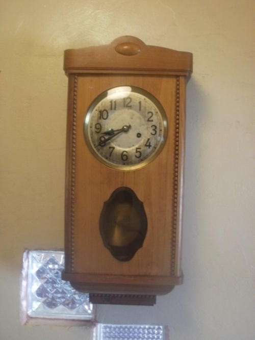 STUNNING WALL CLOCK IN A SOLID WALL NUT CASE