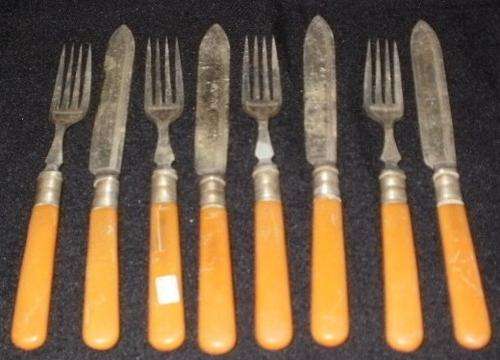 A VERY OLD FISH KNIFE AND FORK SET