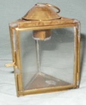 A BRASS AND GLASS MINITURE TRIANGLE CANDLE HOLDER