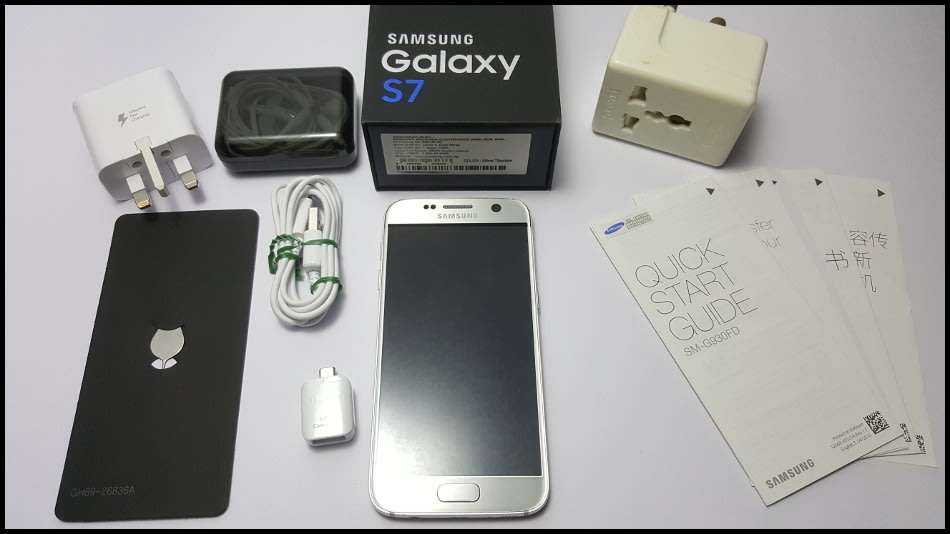 Samsung Galaxy S7 Duos Dual SIM | dbrand & Slickwraps Skins | Silver Titanium 32GB | Wireless Pad