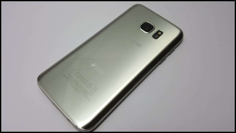 Samsung Galaxy S7 Duos Dual SIM | dbrand & Slickwraps Skins | Silver Titanium 32GB | Wireless Pad