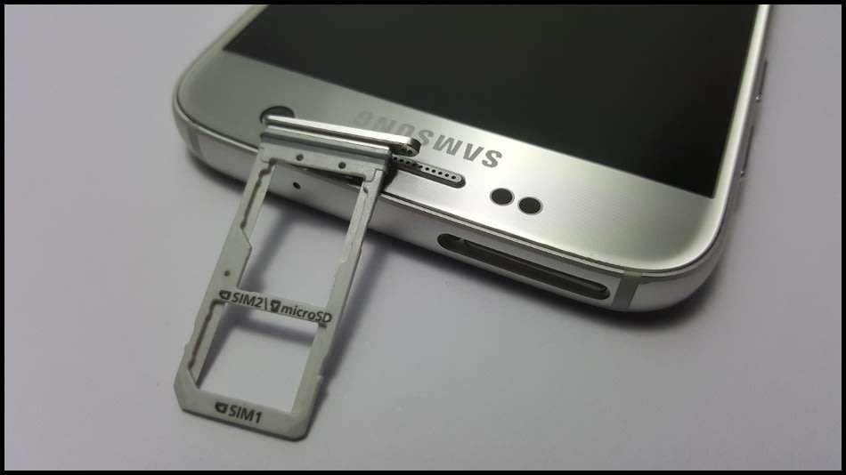 Samsung Galaxy S7 Duos Dual SIM | dbrand & Slickwraps Skins | Silver Titanium 32GB | Wireless Pad