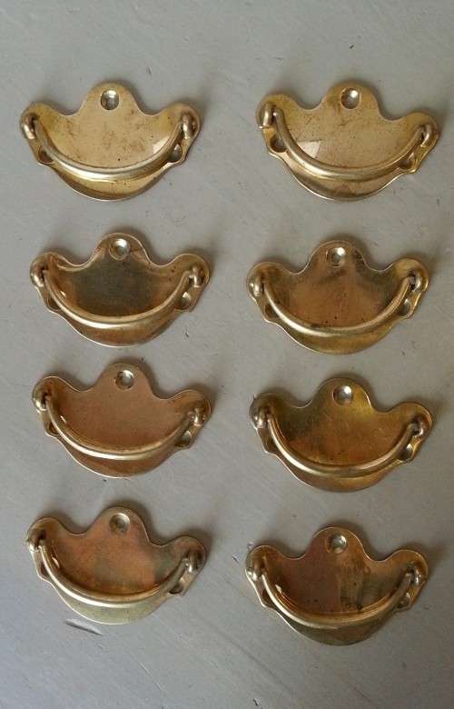 Set of 8 vintage solid brass cabinet drawer pulls.