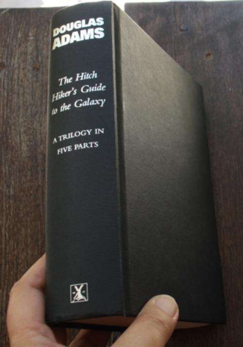 The Hitch Hiker's Guide To The Galaxy, A Trilogy in Five Parts - Douglas Adams