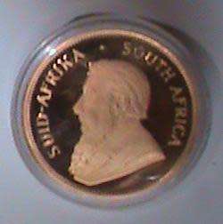 1989 1 Ounce Proof Gold Krugerrand Sealed in a Round Capsule  in a S.A Mint Red Box.