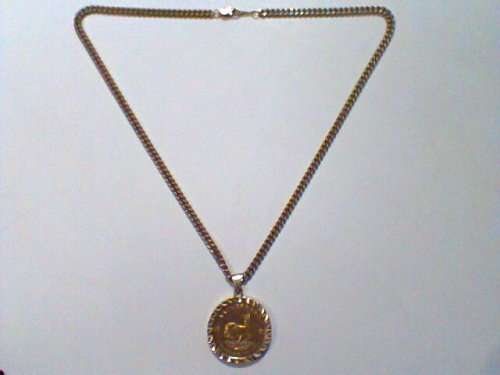 1981 - 1 Ounce Gold Krugerrand On a 14 Carats Gold Mounting With a 9 Carats Gold Chain in a S. M. Re