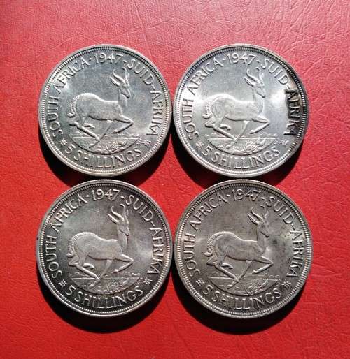 4 X 1947 SILVER CROWNS. 80% SILVER. AU TO UNC CONDITION. BID PER CROWN TO TAKE ALL.
