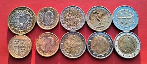 14 EUROS AND 3 BRITISH POUNDS IN COINS. MOSTLY LOOKING UNCIRCULATED.