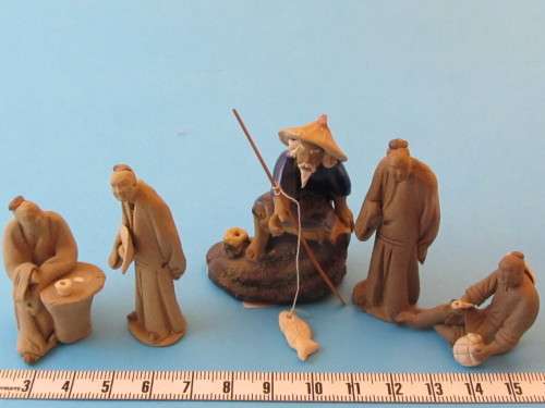 5 tiny Japanese figures made of clay