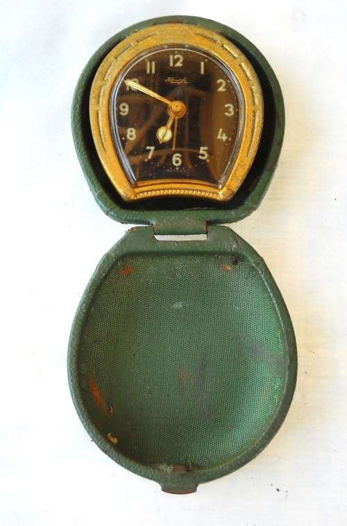 KIENZLE-TRAVEL ALARM CLOCK IN LEATHER HORSE SHOE SHAPED CASE-1950's-NOT WORKING