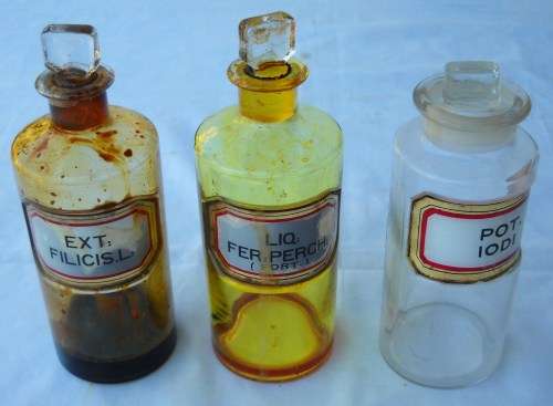 ENAMEL ON GLASS-3 X CLEAR GLASS MEDICINE / APOTHECARY BOTTLES-WITH STOPPERS-VERY GOOD CONDITION