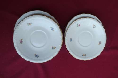 Set of 5 Porcelain saucers with tiny flower pattern and gilded rims.Good conditionn.