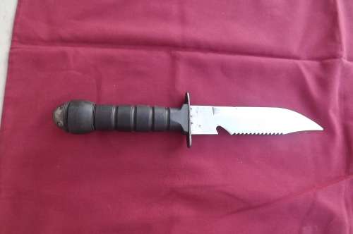 knife with black handle and compass on top.still in good condition.