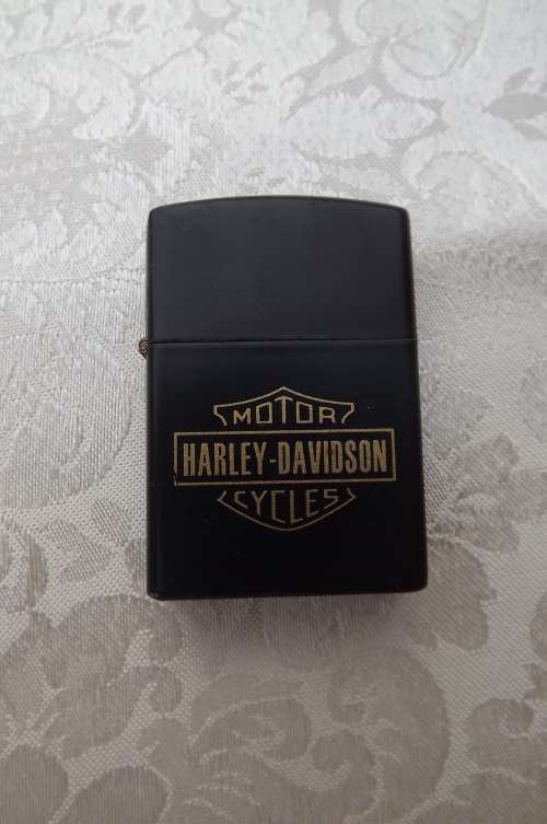 Harley Davidson black fuel lighter flip open. 5.5 x 3.2cm. New item
