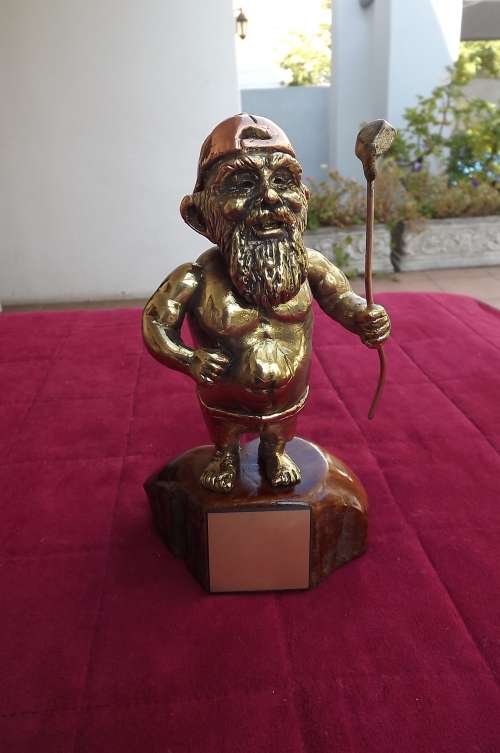 Heavy solid brass and copper golf trophey on wooden base with plate for inscription on front. As new