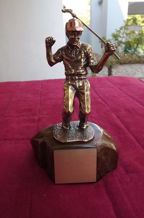 Heavy solid brass and copper golf trophey on wooden base with plate for inscription on front. As new