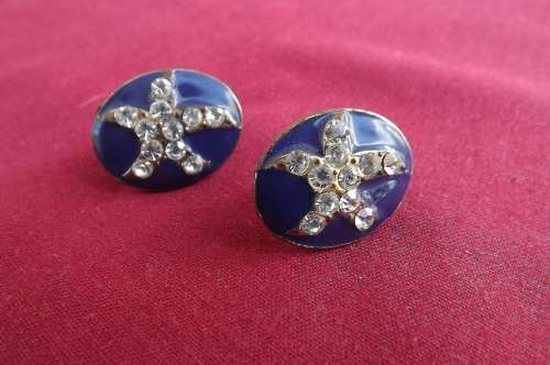 Pair of very old antique piercing earring.In navy enamel with simulated diamond pattern.Oval shape.