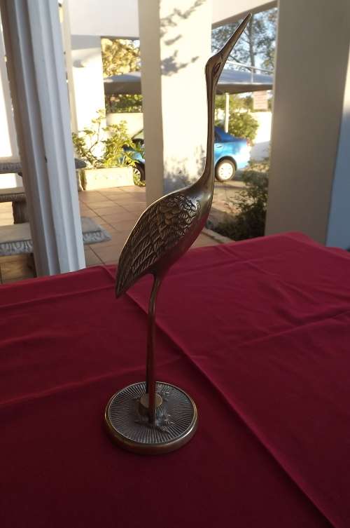 Tall brass bird on stand.Solid brass.Height 31cm