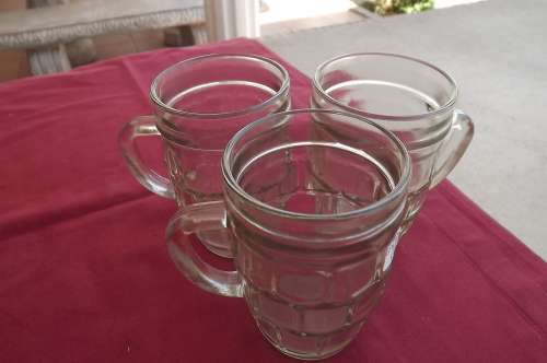 Set of 3 glass mugs in good condition.Height 11cm