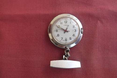 Timex wind-up watch on brooch-good condition,but over wound.