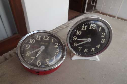 Lot of 2 EQUITY alarm clock.One in beige is in good condition.Wind up but does not work.