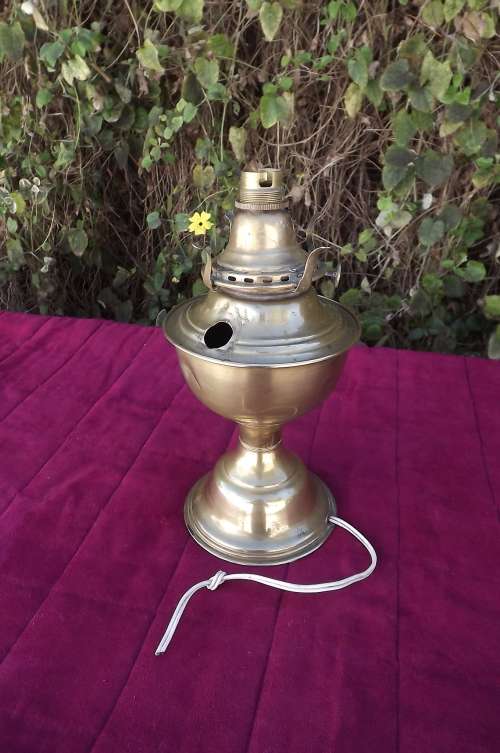 Antique brass lamp.Re done into an electric lamp but can be restored.