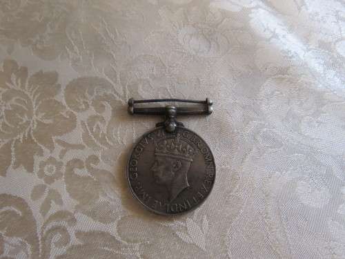 British Common weath medal awarded for service in WW2 without ribbon.Issued to J Roberts M13874