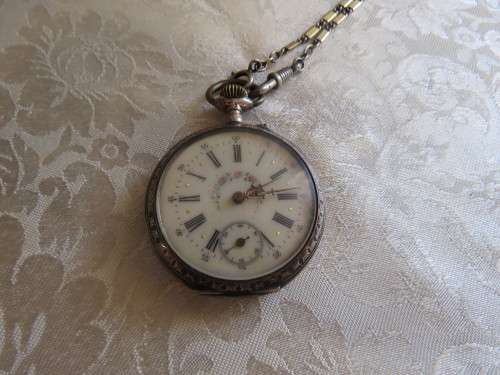Antique pocket watch with chain 800 silver case and cylinder movement.Advance retard.