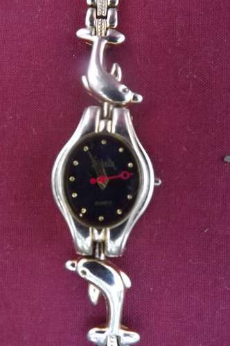 Norita Quartz Watch with Dolphin design strap - worked when tested but winder at side missing