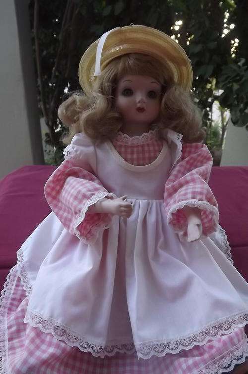 Porcelain Doll with soft torso and porcelain limbs in sitting position - 42cm