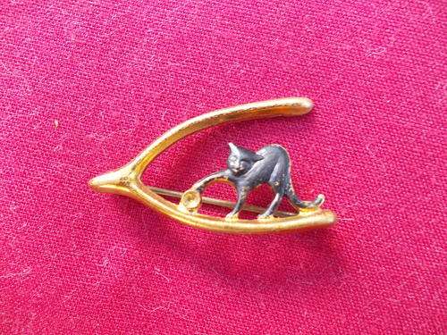 Gold Colour Wishbone Brooch with a black cat on it