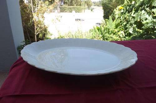Large vintage white porcelain serving plate with scallopededge.41 x 30 cm.Good condition
