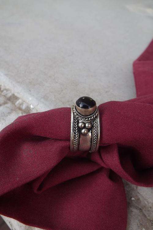 Beautiful wide ring with black stone.Not marked silver-only plated.Good condition