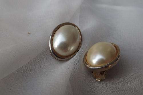 Pair of oval clip on earrings.Pearl look