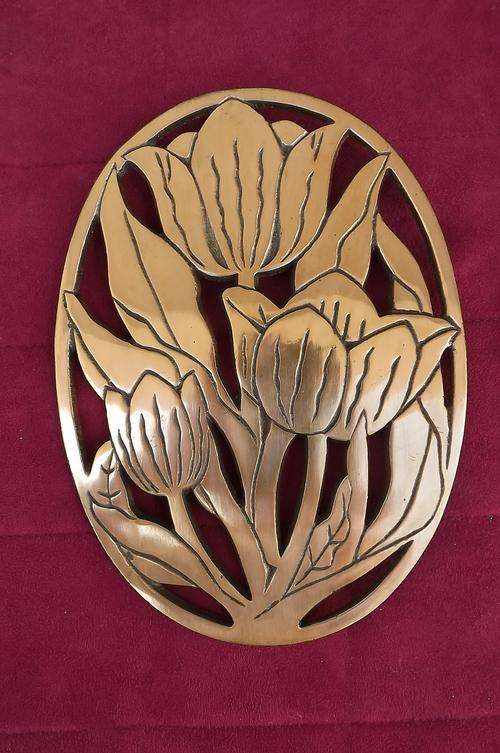 Beautiful copper decor trivet in lily design.Can be hung or use as pot stand.21x15.5cm.As new.