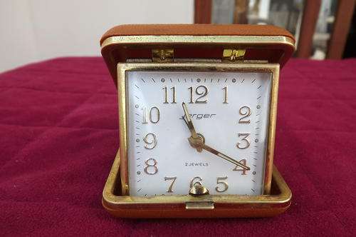 Jerger vintage fold up alarm clock.Made in Germany.Wind up.Working for periods-then stops.