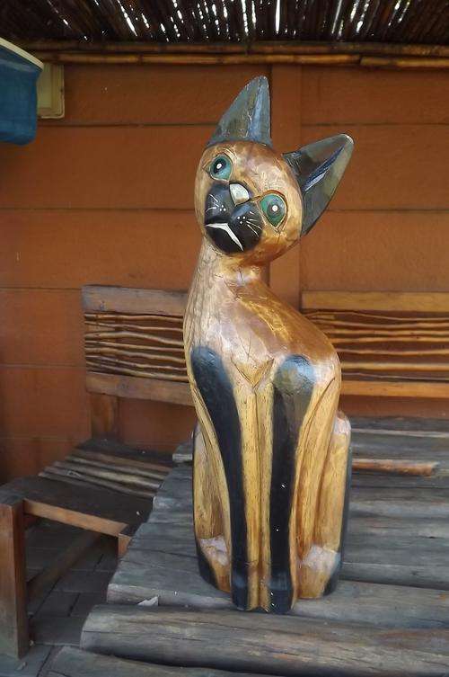 Ornament of wooden cat 50 cm high with mysterious blue eyes.Good condition