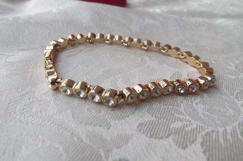 Fabulous gold  toned bracelet with small imitation diamonds.New condition