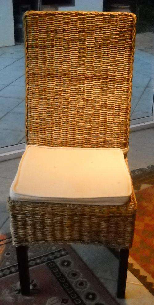 Imported wood and woven cane dining chairs