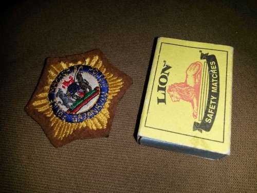 Silk thread (brown felt backing) embroidered Gazankulu Police "cap" badge - unused new condition