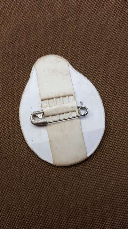 very VERY rarely seen period original MPLA pin-on plastic badge in great used condition