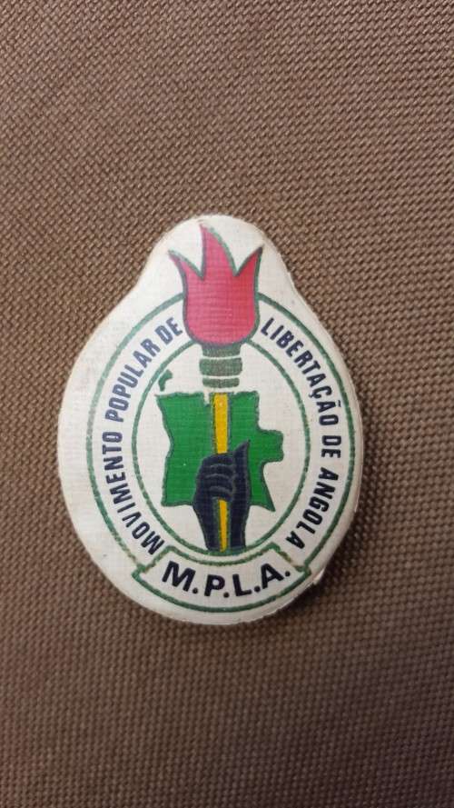 very VERY rarely seen period original MPLA pin-on plastic badge in great used condition