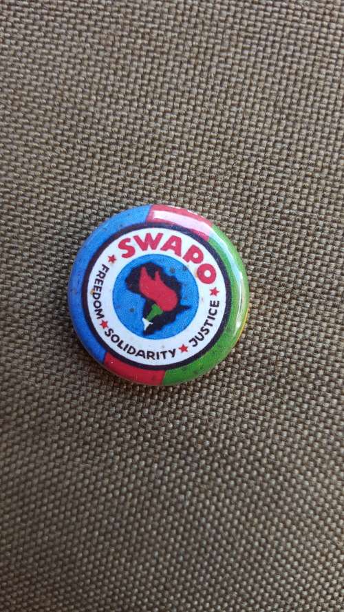 scarce period original SWAPO pin-on small metal round badge in great almost unused condition