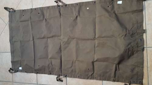 field damaged SADF era nutria ground-sheet (field stretcher) besides burn holes near mint condition