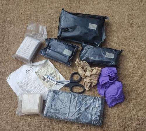 a 8 piece job-lot of GWOT era medical supplies (all timex) and suited to training use - all unused