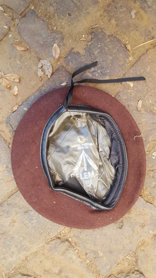 a unknown SADF era "plum" or dark brown colour wool beret dated 1977/8 - in unused good condition no
