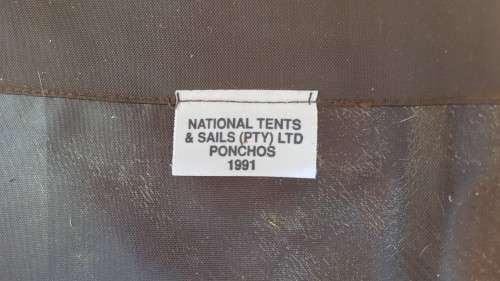 used SADF era dark nutria brown poncho almost unused no damage all strings present - water proofing